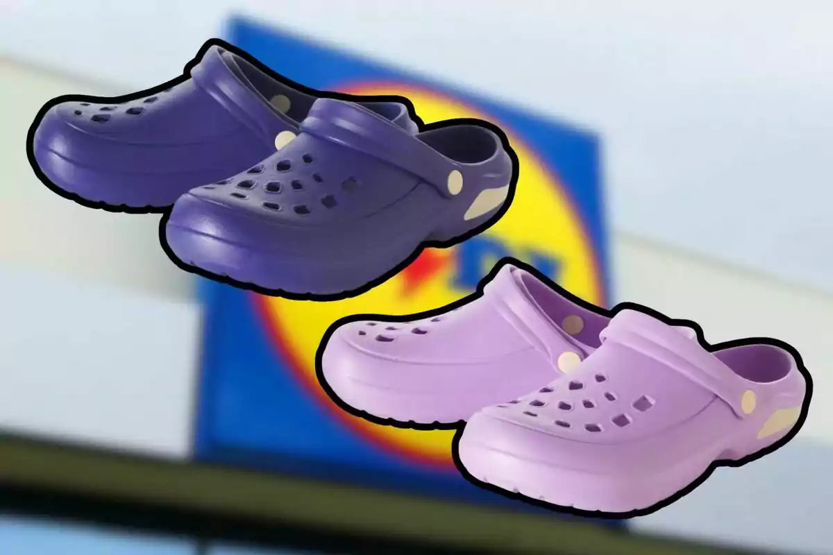 Two pairs of Crocs-style sandals in purple and lilac with a blurred background of a supermarket sign. Two pairs of Crocs-style sandals in purple and lilac with a blurred background of a supermarket sign.
