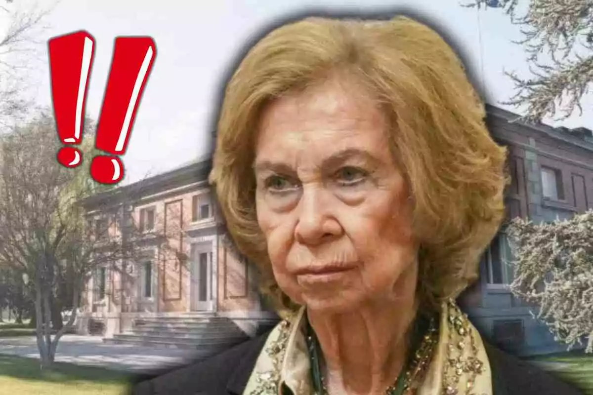 Queen Sofía with a serious expression in the foreground, with a building in the background and two red exclamation marks on the left