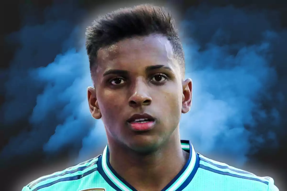 A young man in a sports jersey on a background of blue smoke.